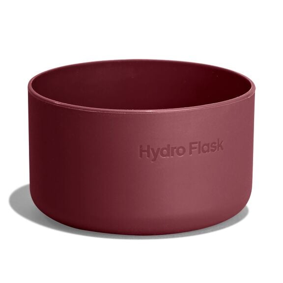 Maroon Hydro Flask silicone cup or boot with smooth matte finish, straight sides, rounded bottom edge, and embossed brand name on the side.