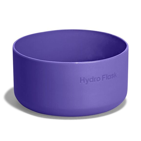 Purple Hydro Flask silicone bottle boot with smooth rounded shape, thicker base, wide open top, and "Hydro Flask" embossed on the side.