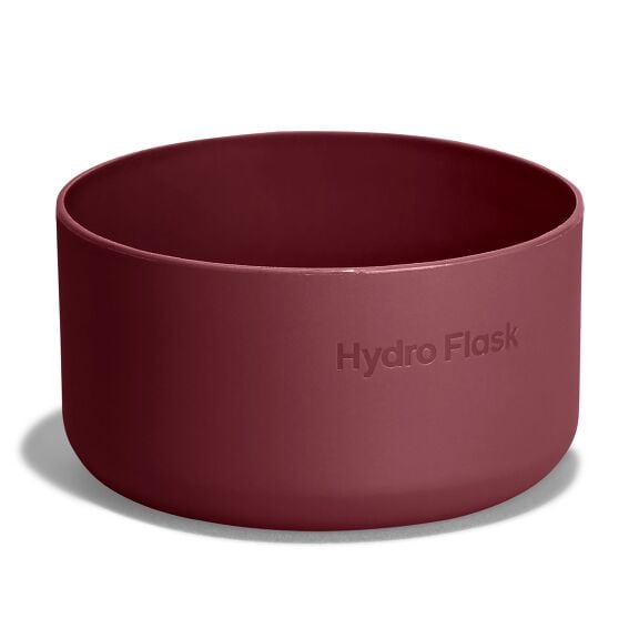 Maroon Hydro Flask silicone bowl with smooth rounded sides, matte finish, and embossed brand name on exterior. Studio lighting on white background.