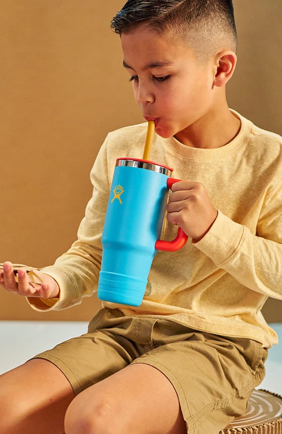 young boy drinking out of a hydro flask kids tumbler