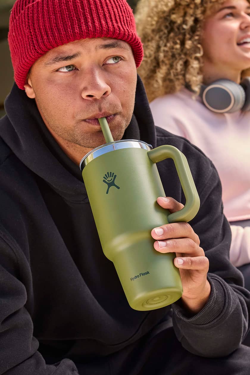 Man drinking out of a Hydro Flask Palmer Green Tumbler