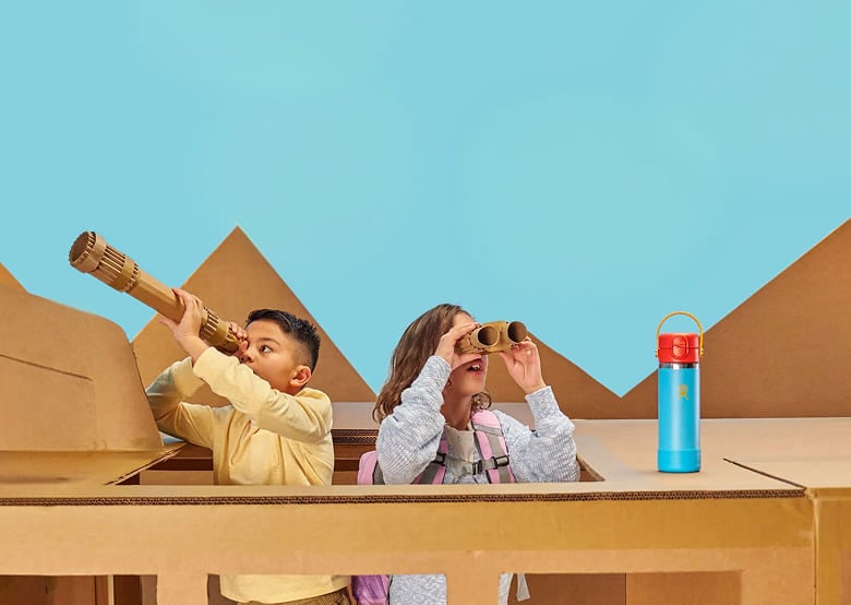 kids using binoculars and a telescope made from cardboard playing